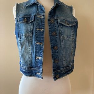Denim vest with frayed edges